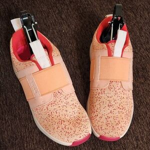 Women’s Peach Slip-On Athletic Sneakers with Elastic straps for secure fit.